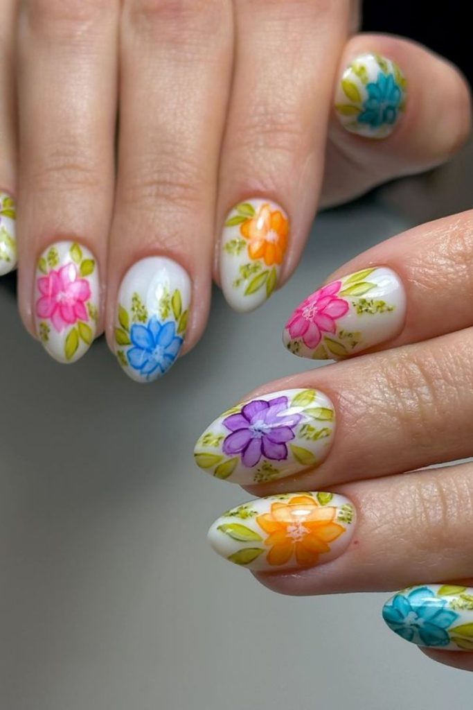 Soft watercolor educational themed nails.