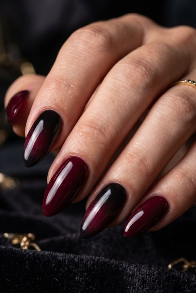 Dramatic black and oxblood nails.