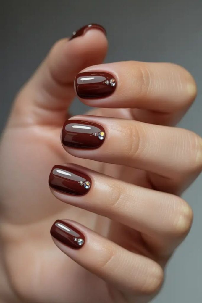 Brown pearl accent manicure design.