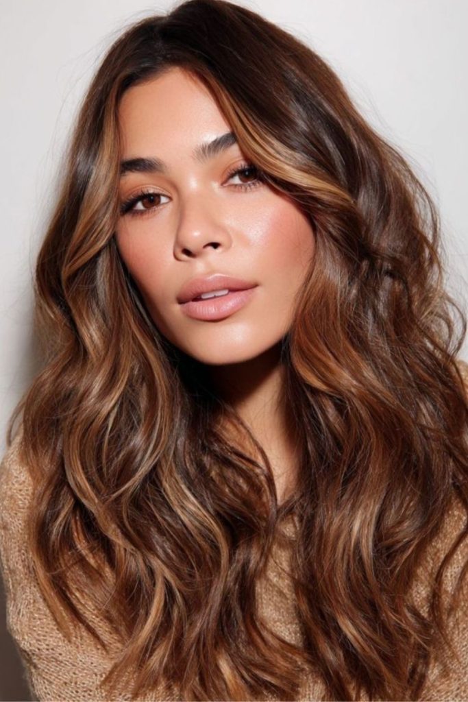 Glossy brunette hair with golden glaze.