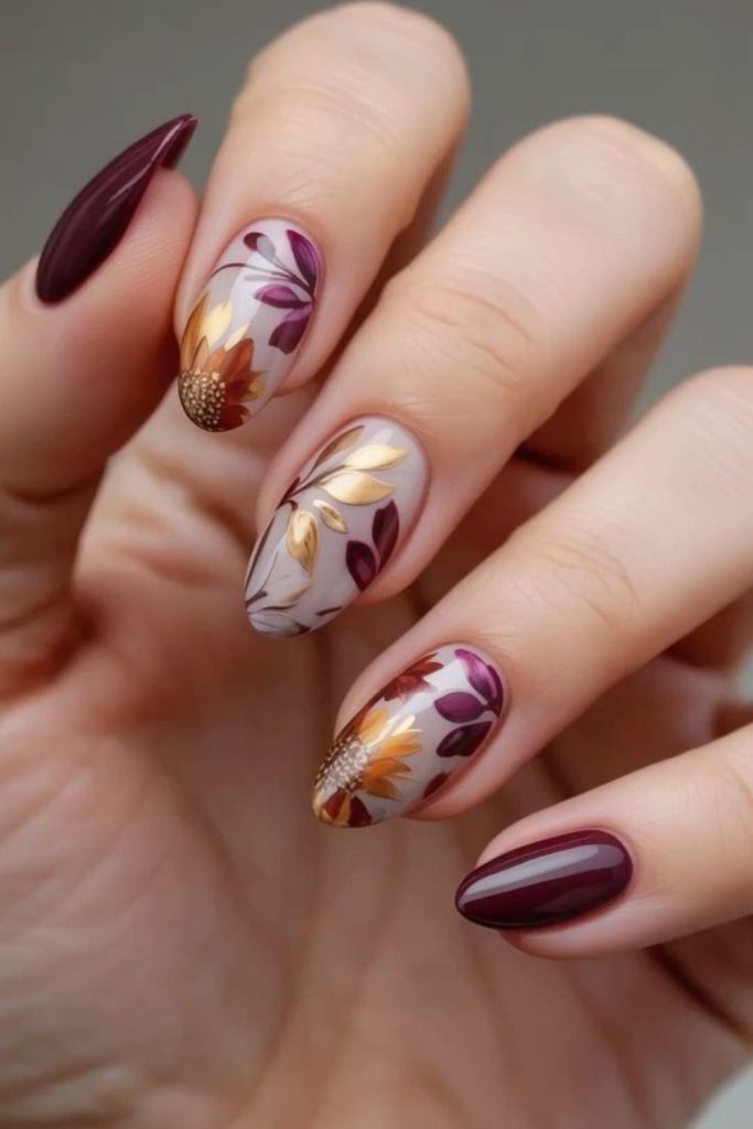 Burgundy harvest floral Thanksgiving manicure.
