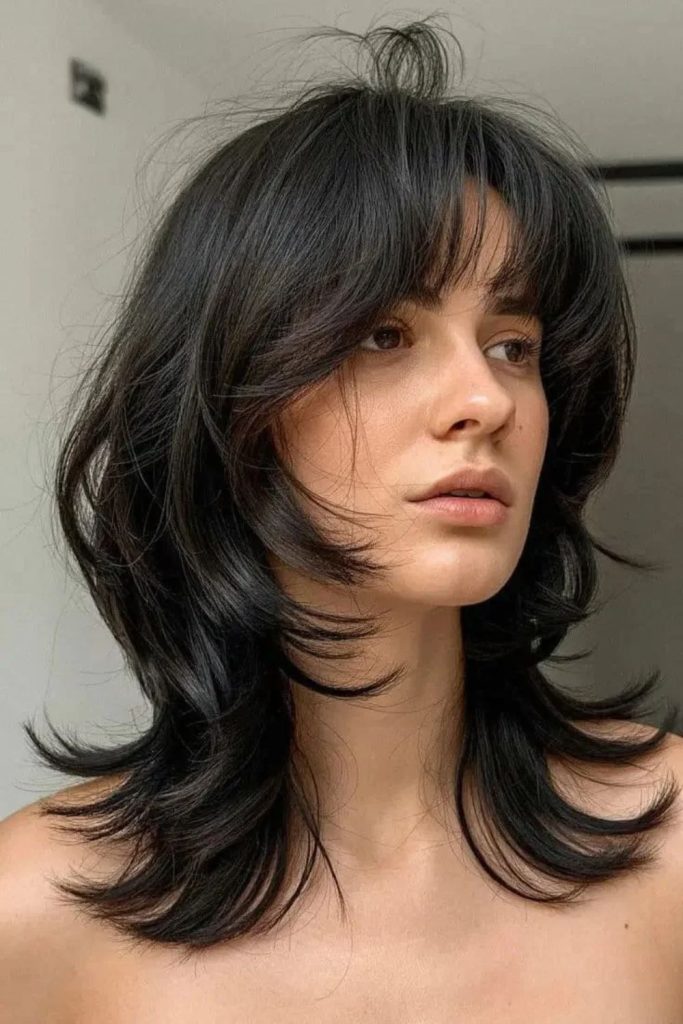Butterfly jellyfish haircut with flowing layers.