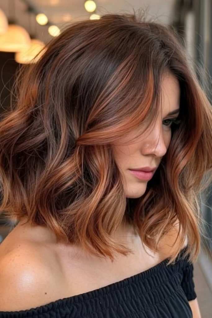 Caramel strawberry brunette hair with ribbons.