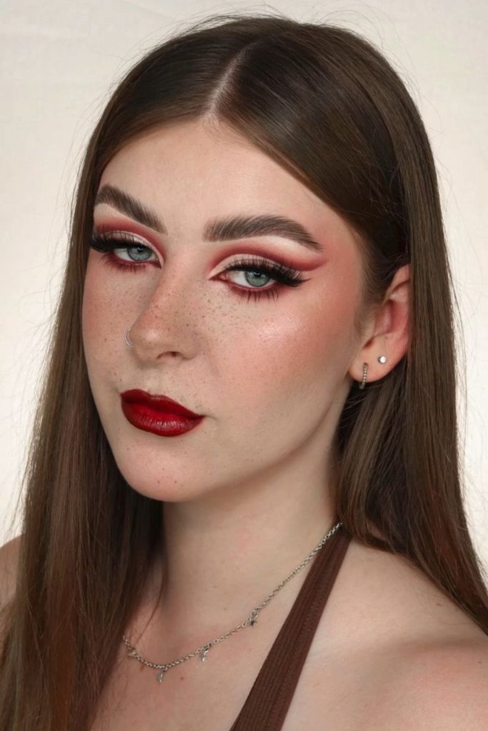 Cherry halo eye makeup with shimmering lids.
