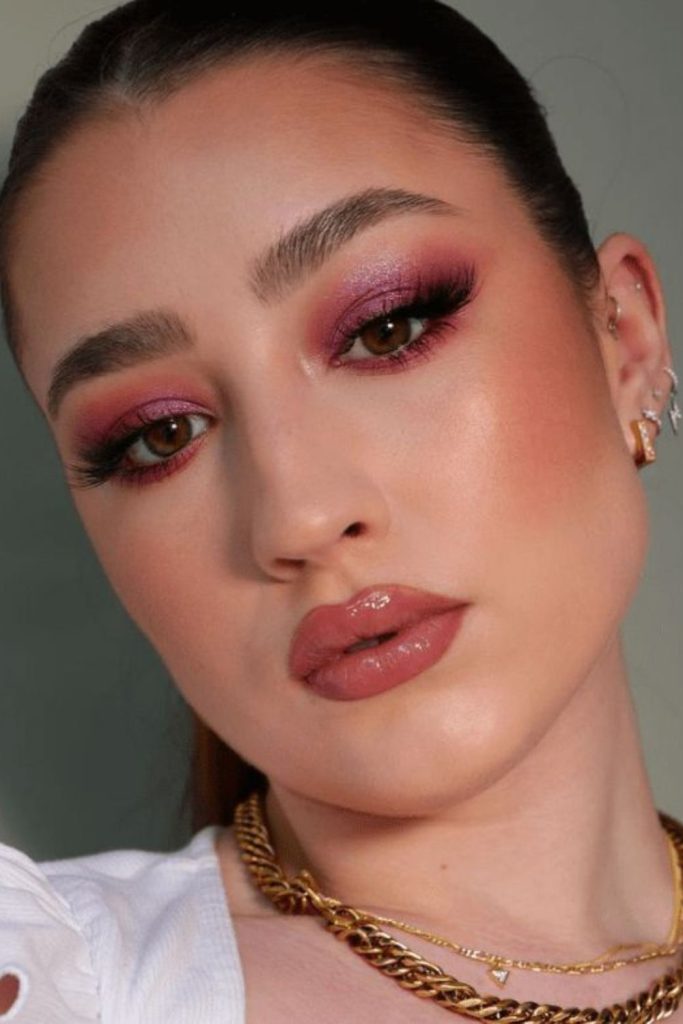 Cherry pink makeup with vibrant rosy cheeks.