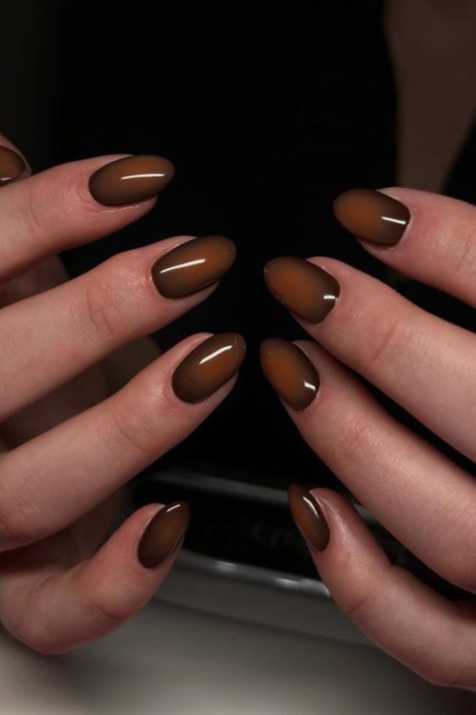 Chocolate brown aura nail design.