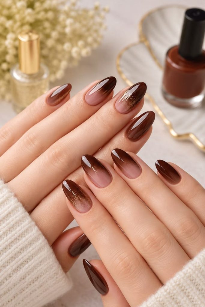 Chocolate brown ombre nail design.