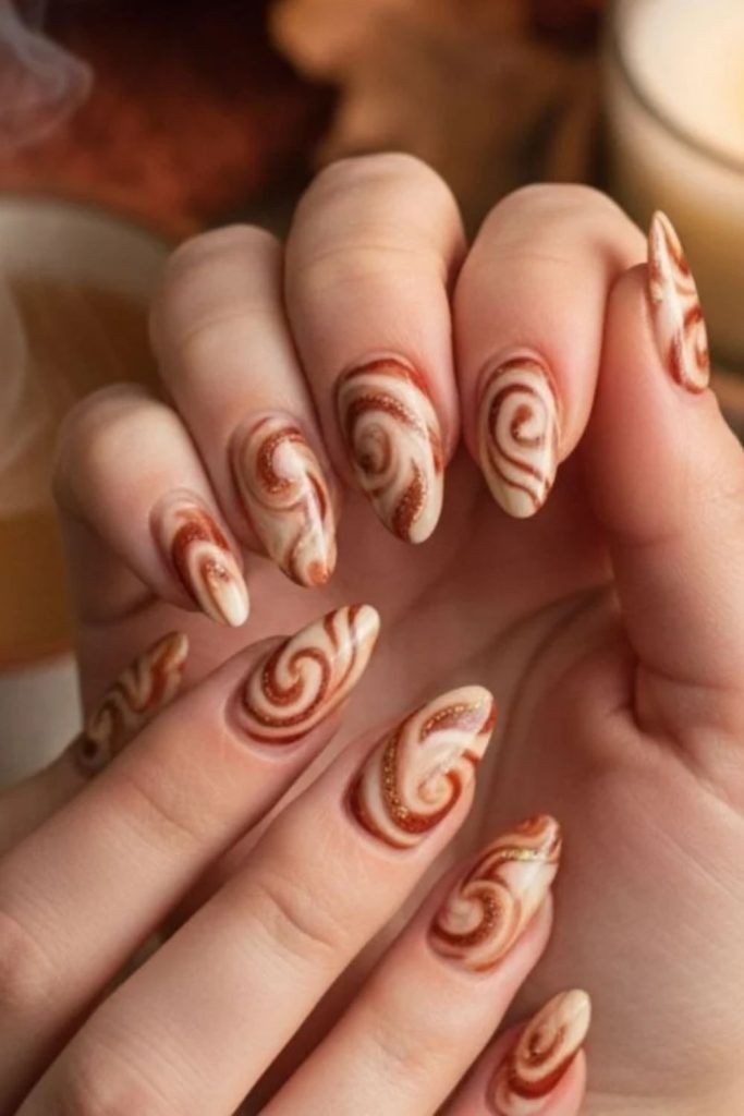 Cinnamon swirl autumn Thanksgiving nails.