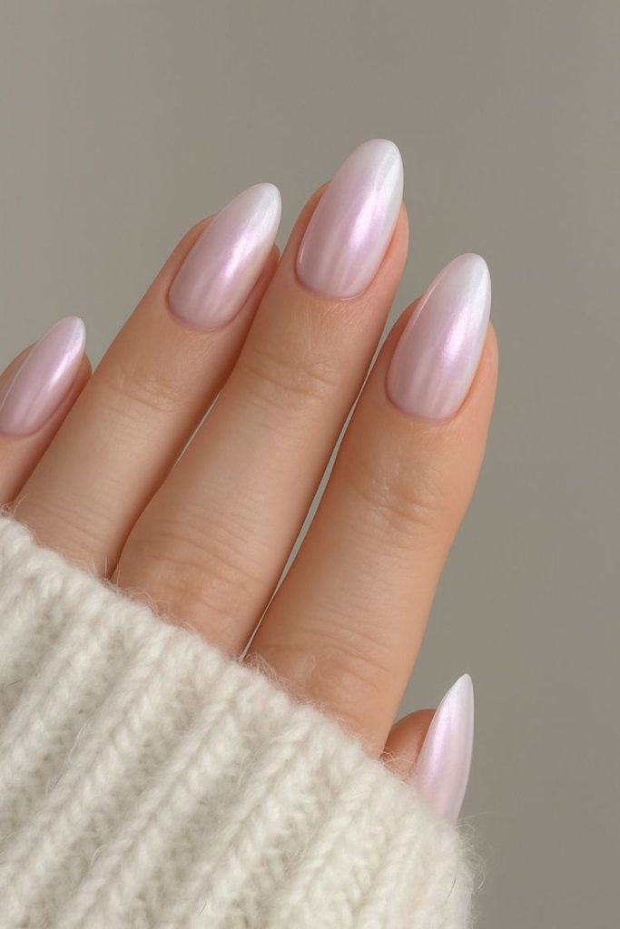 Cloudy pink glazed donut nails.