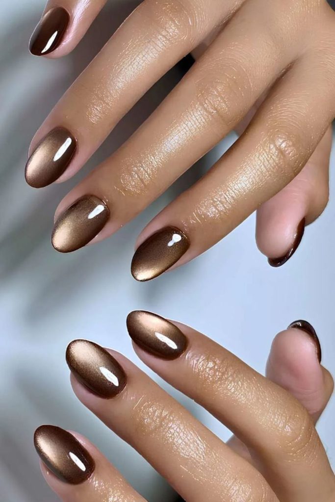 Cocoa brown cat-eye manicure.