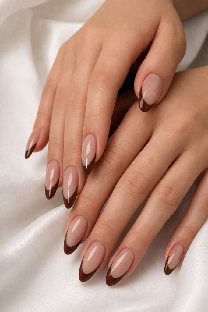 Cocoa brown French tip nails.