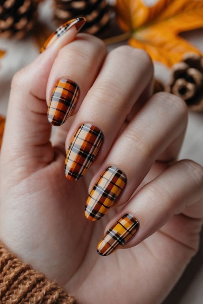 Creamy pumpkin plaid nail design.