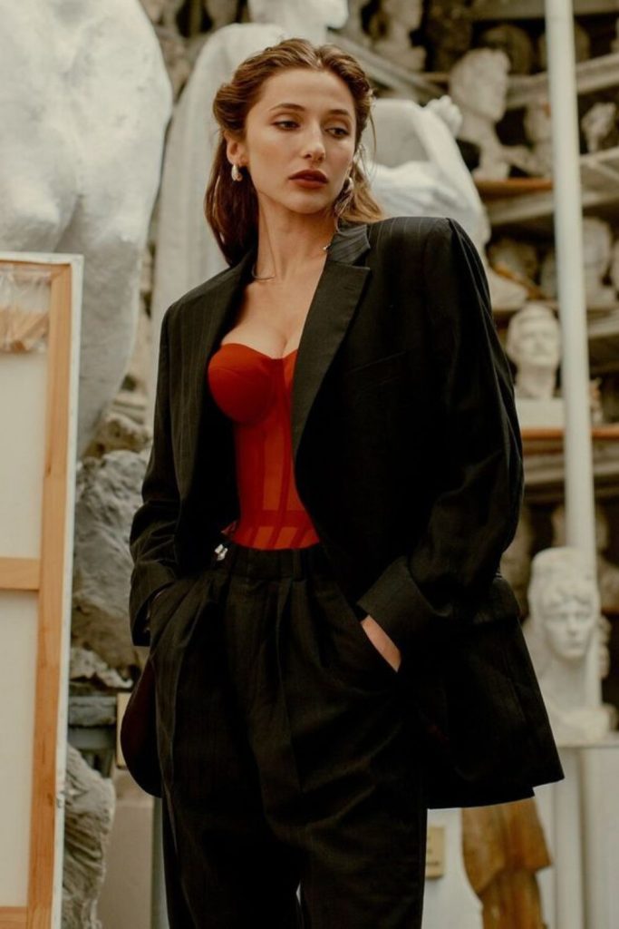 Crimson satin corset evening outfit.