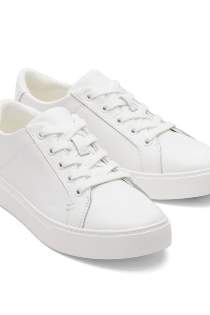 Clean white school sneakers everyday style.