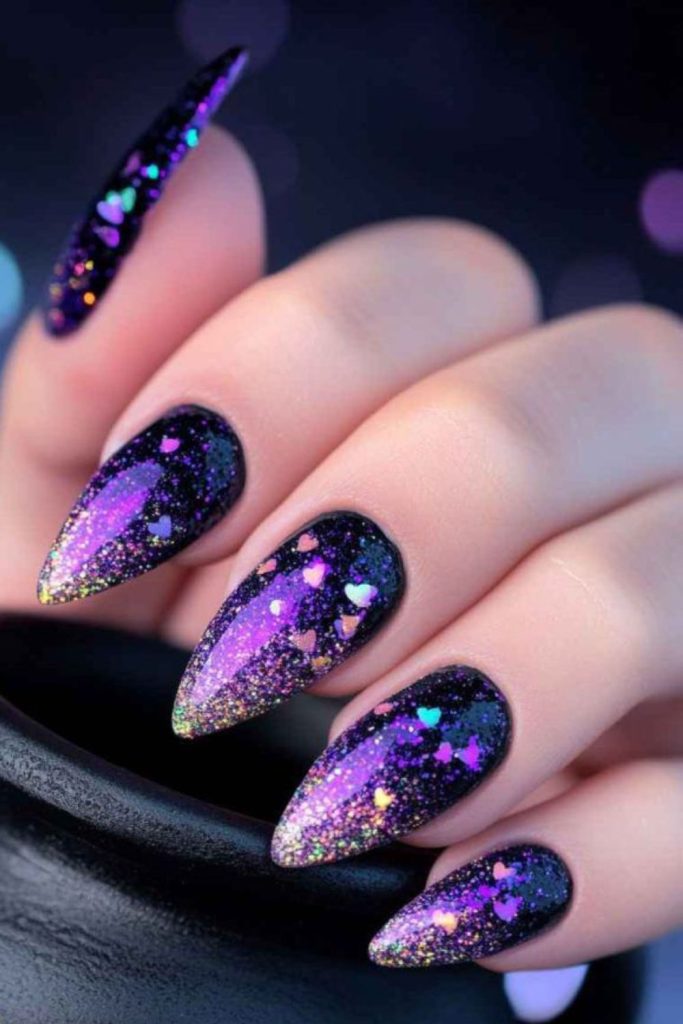 Dark fairy nails with purple glitter.