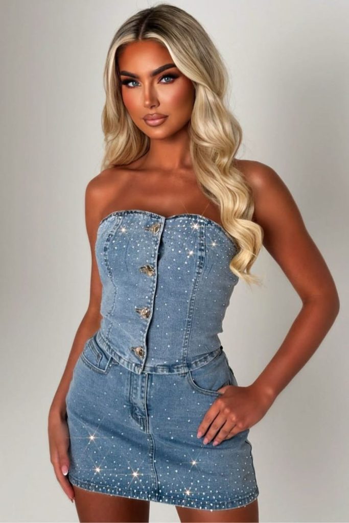 Rhinestone denim bustier with mini skirt.