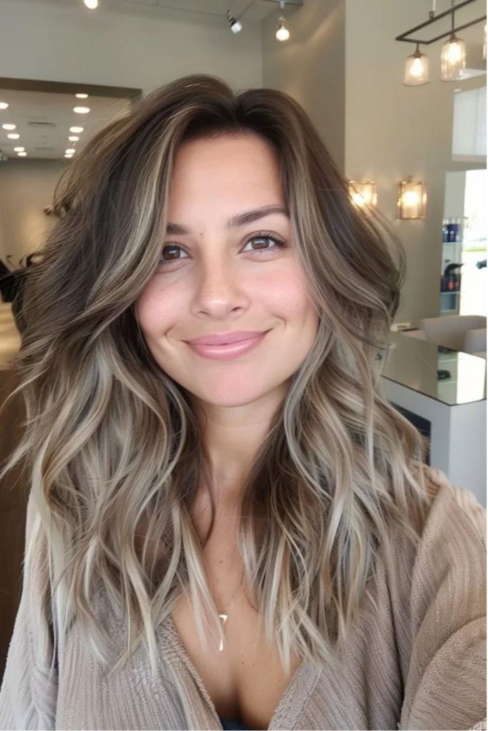 Dusty taupe brunette hair with soft highlights.