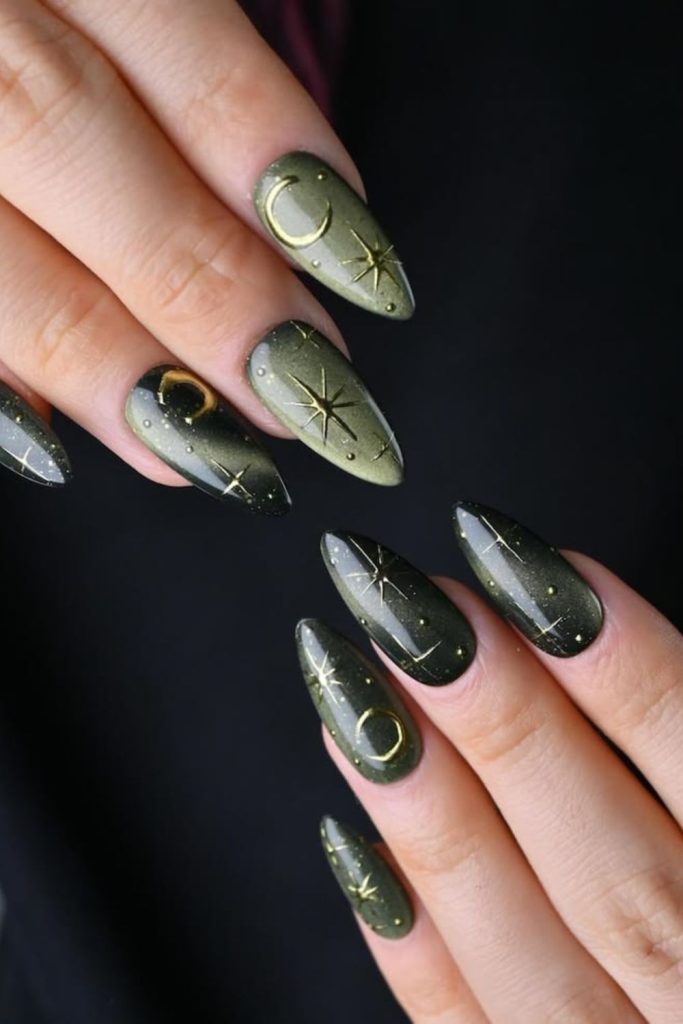 Tarot nails with mystical golden symbols.