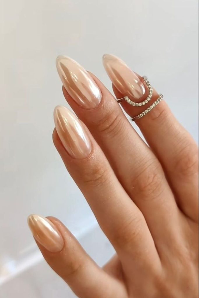 Golden glazed pearl donut nails.