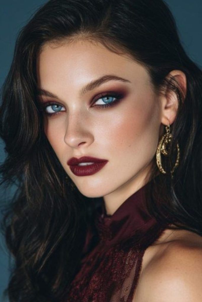 Gothic berry glowing makeup with shimmer.