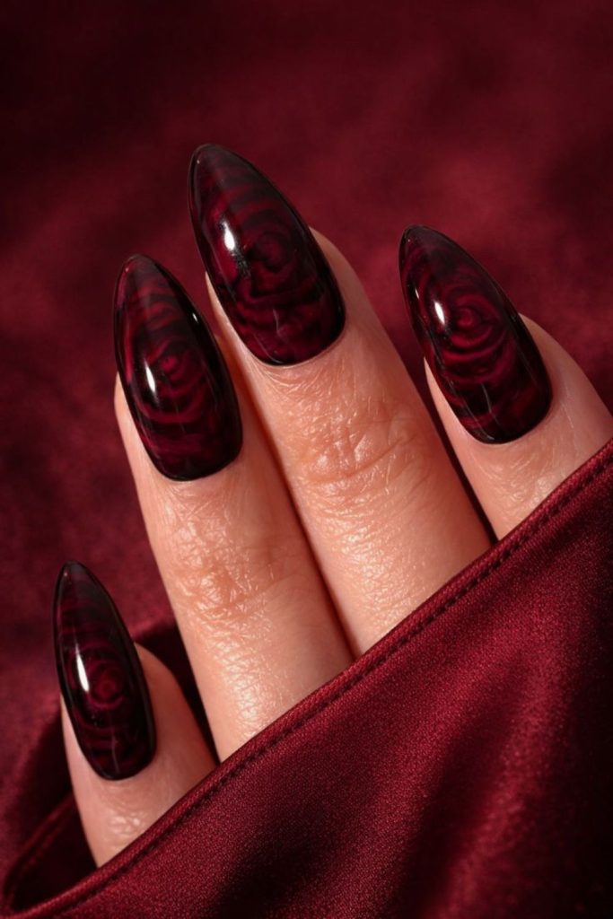 Gothic black nails with crimson roses.