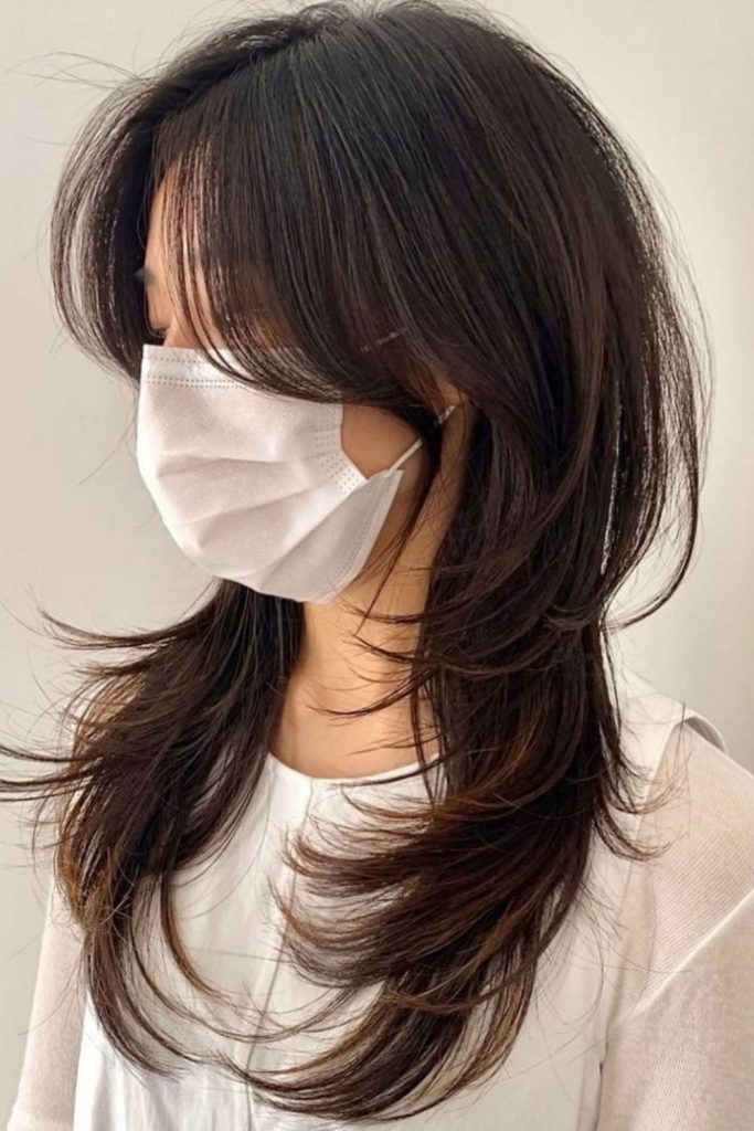 Flicked ends Hush Cut hairstyle.