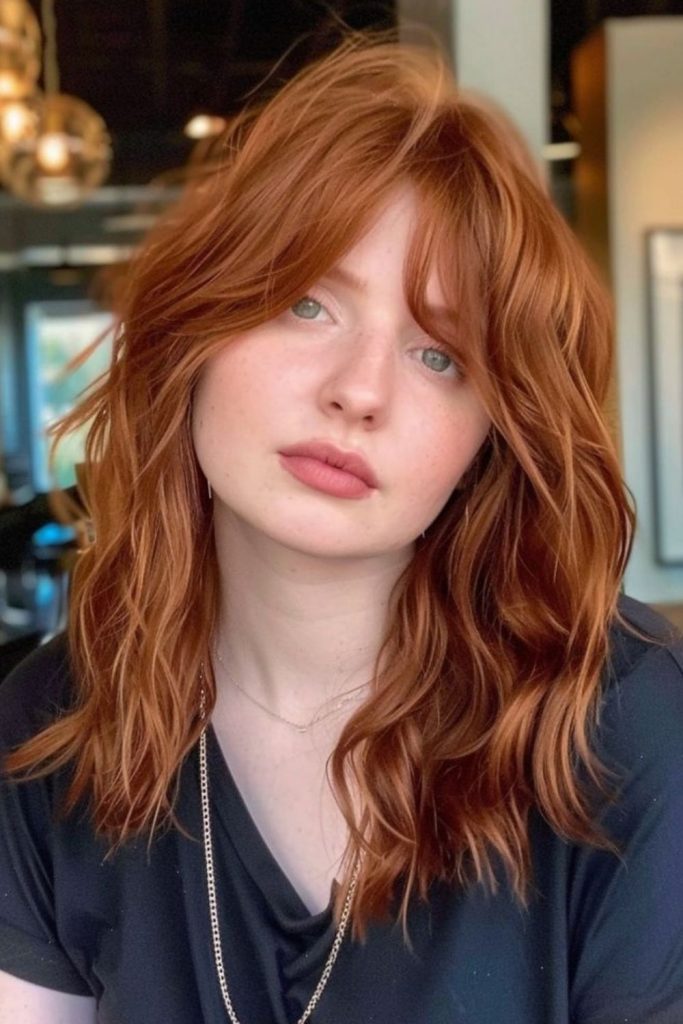 Hush Cut with voluminous bangs.