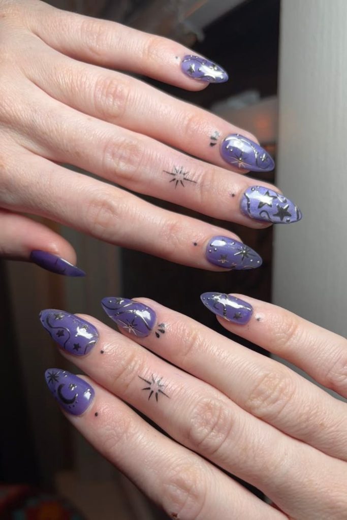 Lavender nails featuring mystical crescent moons.