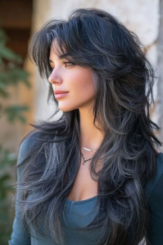 Long feathered Hush Cut hairstyle.