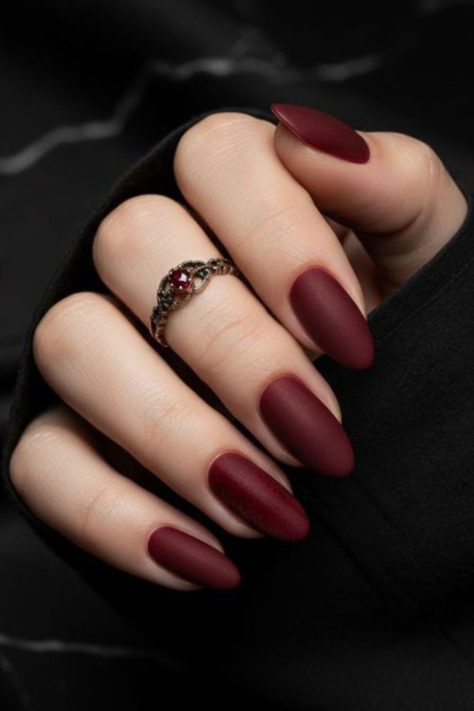 Matte oxblood short square nails.