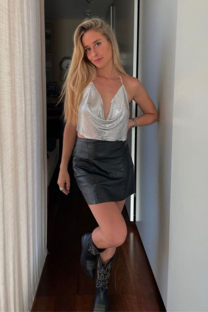 Metallic silver corset with leather skirt.