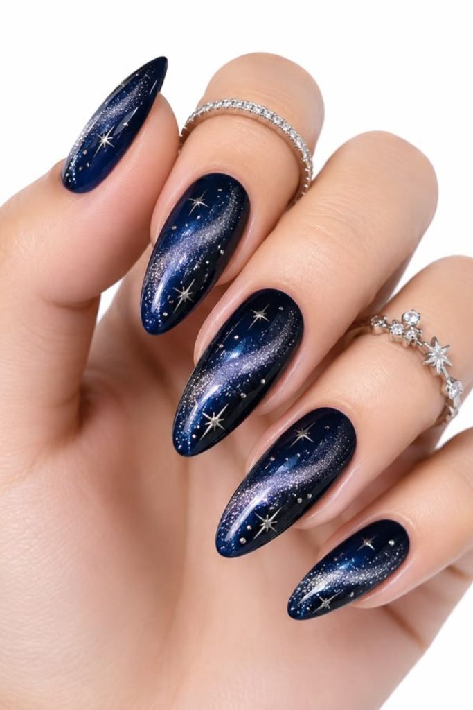 Midnight black nails with silver stars.