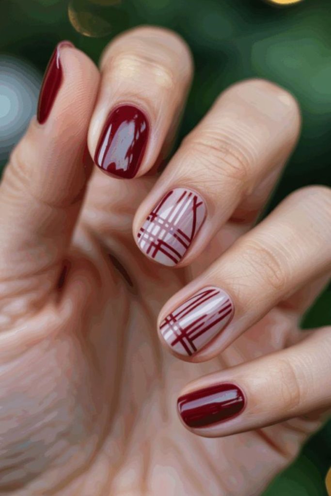 Minimal oxblood line nail art.