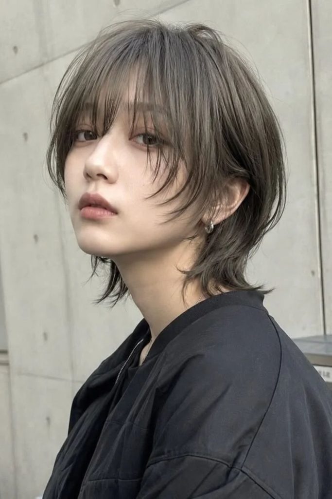 Minimalist jellyfish haircut with clean layers.
