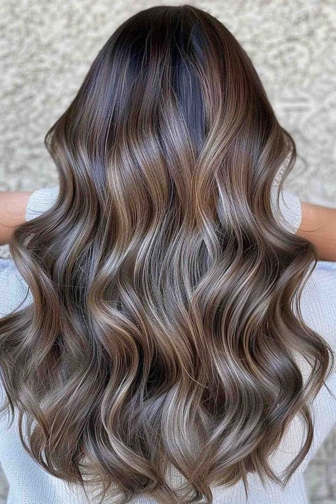Mocha mushroom brown hair with subtle waves.