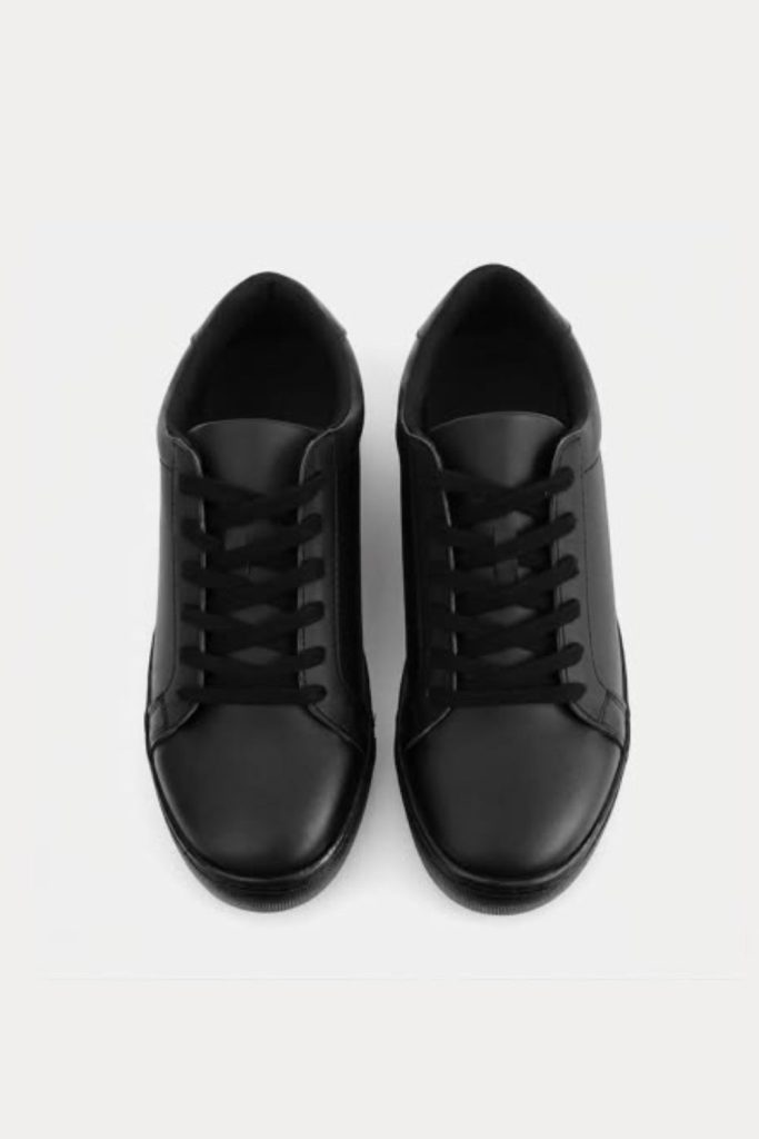 All black minimalist school sneakers.