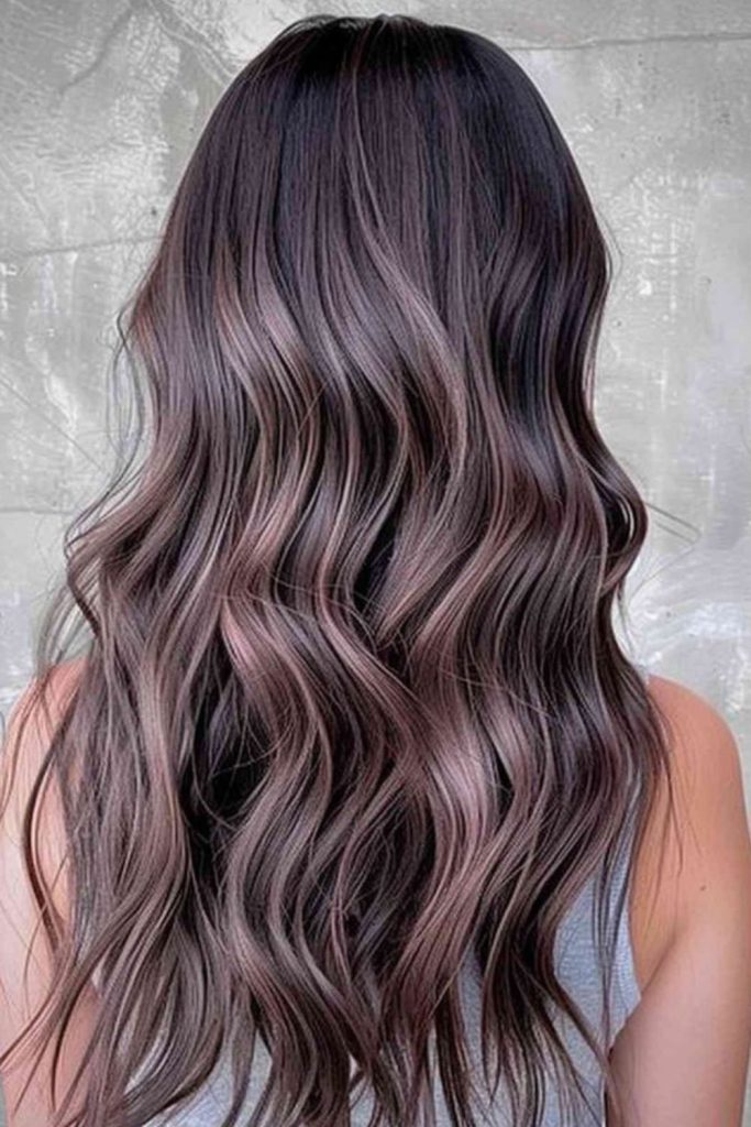 Mushroom brown hair with subtle plum undertones.