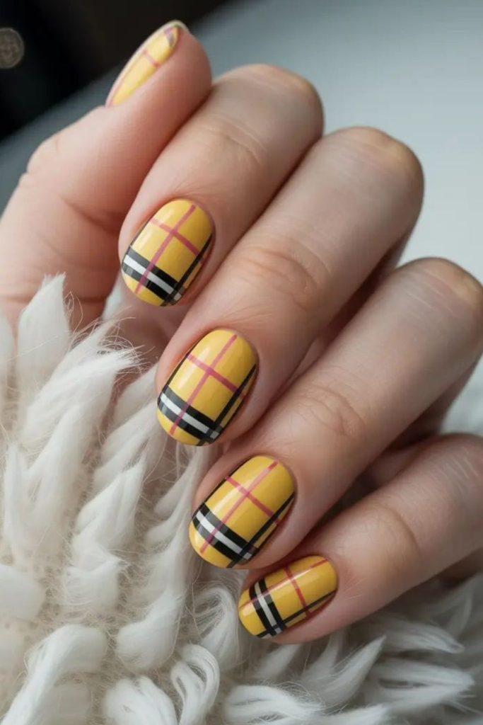 Mustard tartan plaid nail design.