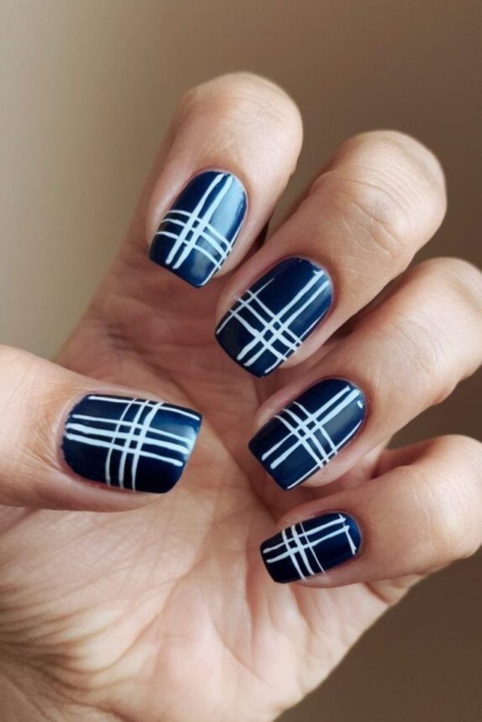 Navy preppy plaid nail design.