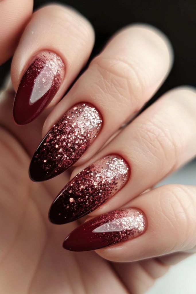 Glitter fading over oxblood nails.