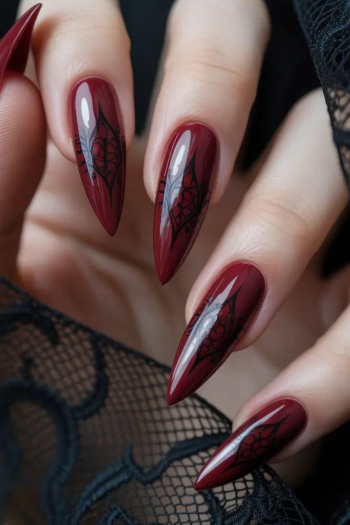 Delicate oxblood lace nail art.