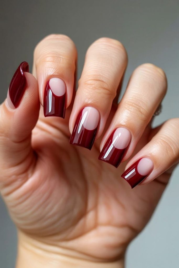 Modern oxblood negative space nails.