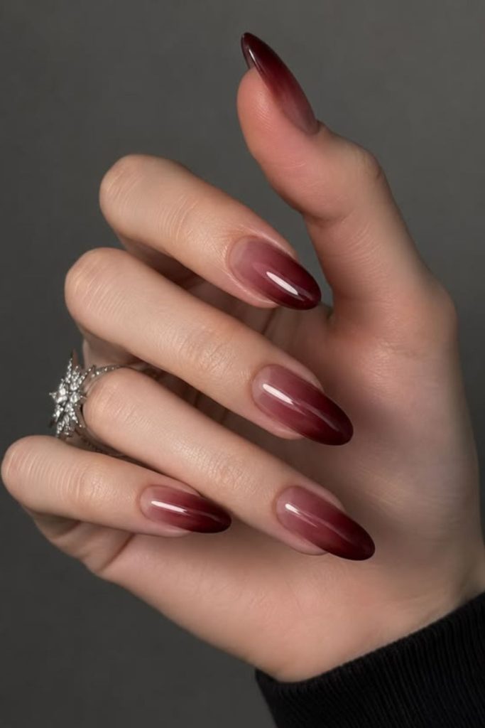 Velvet oxblood French tip manicure.