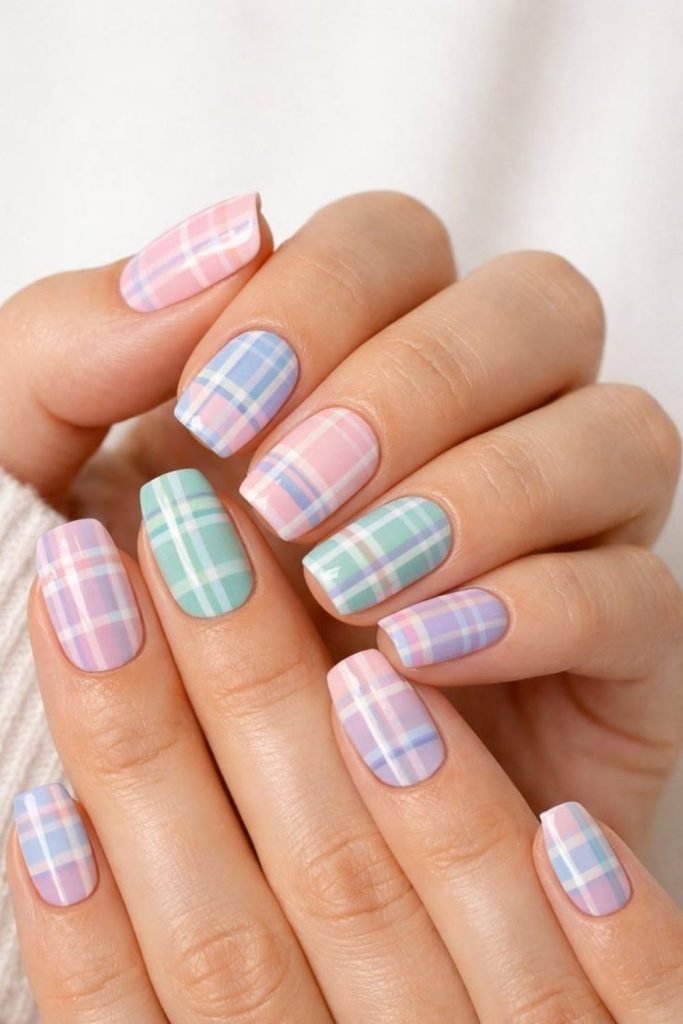 Pastel rainbow plaid nail design.