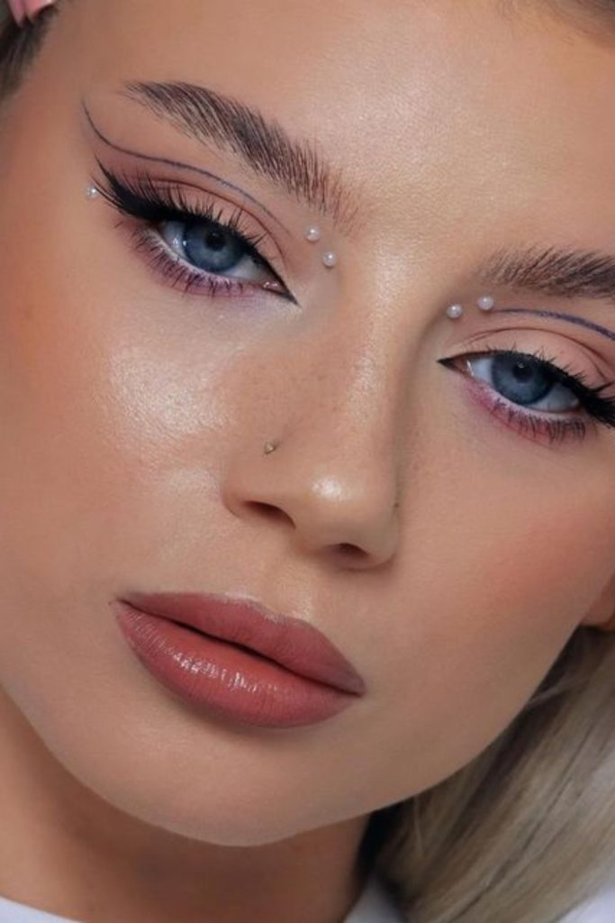 Pearly inner corner eye makeup.