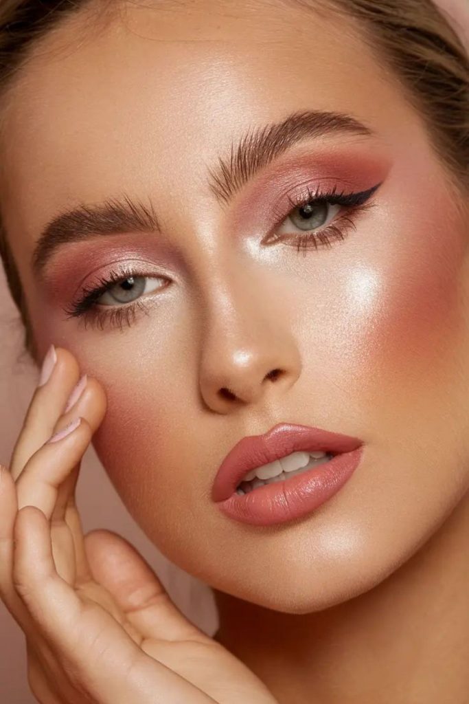 Pink peach sunset makeup look.
