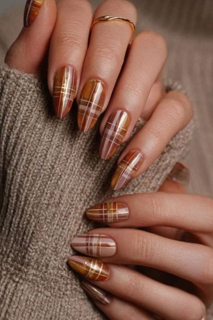 Pumpkin spice plaid Thanksgiving nails.