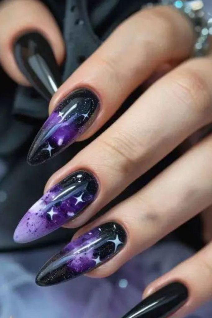 Purple potion nails with glossy drips.