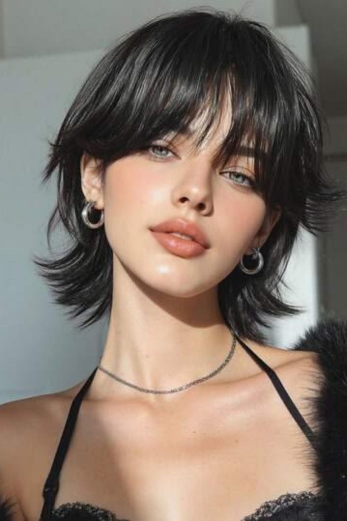 Short layered Hush Cut bob.