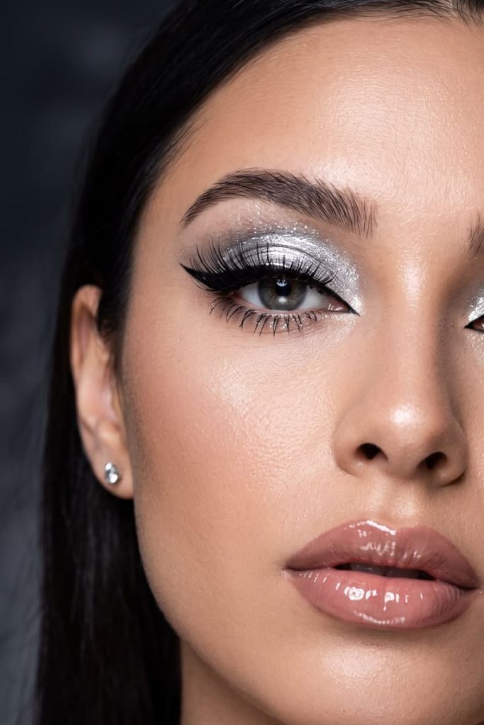 Silver chrome futuristic eye makeup.